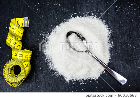 problem of excess weight, diabetes. measuring tape and sugar 60010668