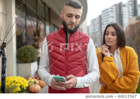 Nice dark haired woman looking from the shoulder Nice dark haired woman looking from the shoulder 60013567