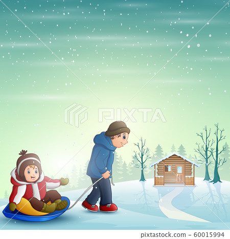 Father pulling his son riding on a sled 60015994