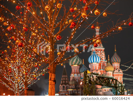 Moscow. Russia. New year entertainment on red square. Kremlin. St.Basil Cathedral. Red square is decorated for Christmas. Preparing for holiday. Winter trip to the capital of the Russian Federation Moscow. Russia. New year entertainment on red square. Kremlin. St.Basil Cathedral. Red square is decorated for Christmas. Preparing for holiday. Winter trip to the capital of the Russian Federation 60016424