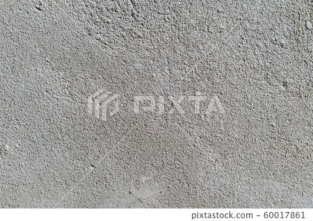 Gray textured cement wall background with fine concrete chips. Construction backgrounds Gray textured cement wall background with fine concrete chips. Construction backgrounds 60017861