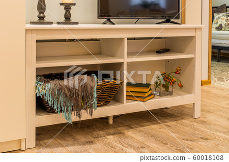 Wooden white TV stand in the interior of the house Wooden white TV stand in the interior of the house 60018108