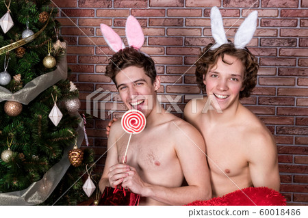 Two funny guys in suits rabbits celebrating 60018486