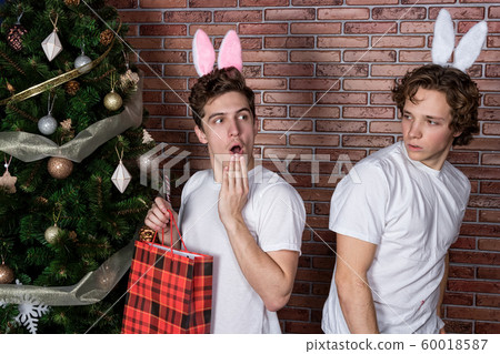 Two funny guys in suits rabbits celebrating Two funny guys in suits rabbits celebrating 60018587