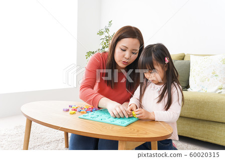 Parent and child studying at home Parent and child studying at home 60020315