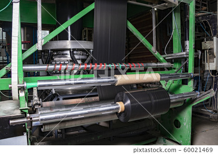 Black plastic trash bags are rolled up. Extruder 60021469