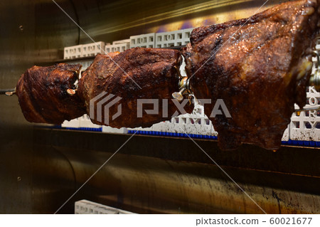 Fresh Cooked Racks of Ribs in a Rotisserie Fresh Cooked Racks of Ribs in a Rotisserie 60021677