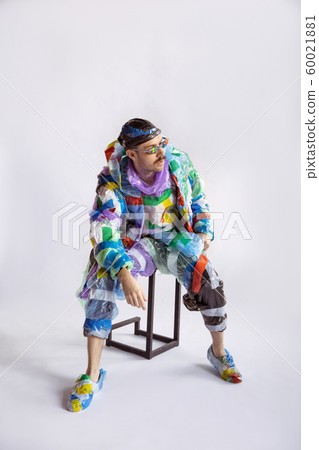Man addicted of sales and clothes, wearing plastic, recycling concept 60021881