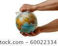 A man removes a plastic bag from the globe 60022334