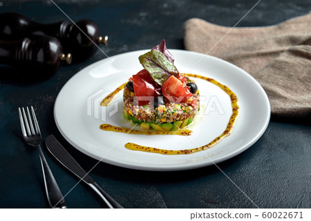 Delicious quinoa salad with avocado and tomatoes. Macro. Delicious quinoa salad with avocado and tomatoes. Macro. 60022671