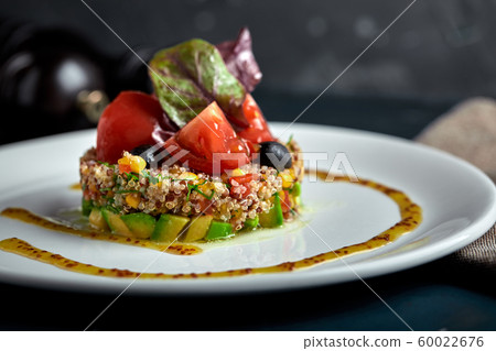 Delicious quinoa salad with avocado and tomatoes. Macro. 60022676
