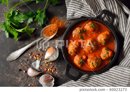 Spicy meatballs in tomato sauce, a typical Spanish and Mexican bar food, so called albondigas 60023273