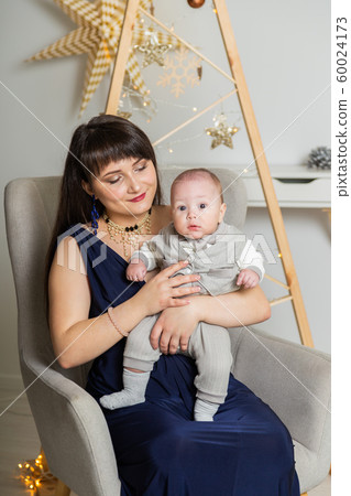 Beautiful and happy mom with a little son in the Beautiful and happy mom with a little son in the 60024173