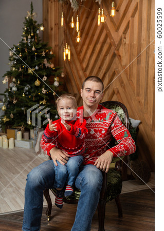Happy man with son in a New Year's decor. Happy 60025599