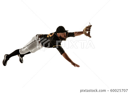 Baseball player, pitcher in a black uniform practicing on a white background. Baseball player, pitcher in a black uniform practicing on a white background. 60025707
