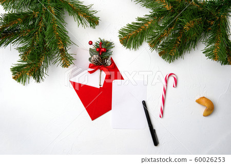 Photo of red envelope, cookies, branches of spruce Christmas decorations on white background Photo of red envelope, cookies, branches of spruce Christmas decorations on white background 60026253