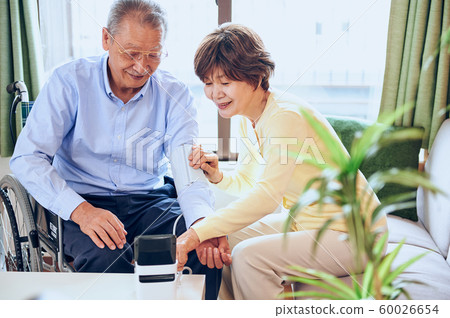 Wheelchair and old couple Wheelchair and old couple 60026654