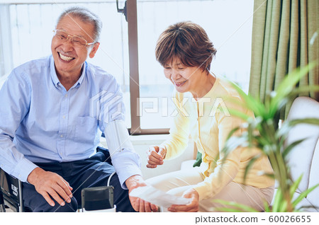Wheelchair and old couple Wheelchair and old couple 60026655