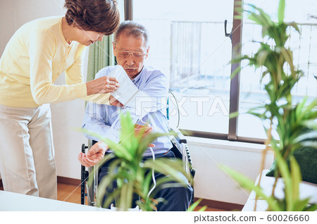 Wheelchair and old couple Wheelchair and old couple 60026660