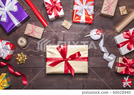 Christmas presents on wooden table 60028940