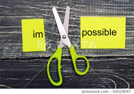 Impossible Is Possible Concept. card with the text impossible, scissors cut a word to them. success and challenge concept. I can, goal achievement, potential, overcoming 60029697