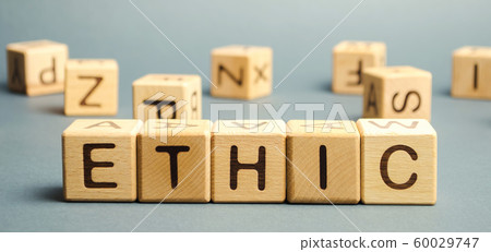 Wooden blocks with the word Ethic. Defending, systematizing and recommending concepts of right and wrong conduct. Moral philosophy 60029747