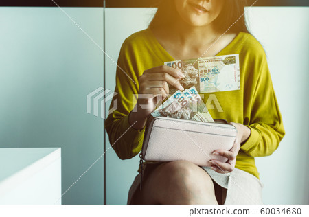 Hands woman counting five hundred hong kong banknotes,Close up Hands woman counting five hundred hong kong banknotes,Close up 60034680