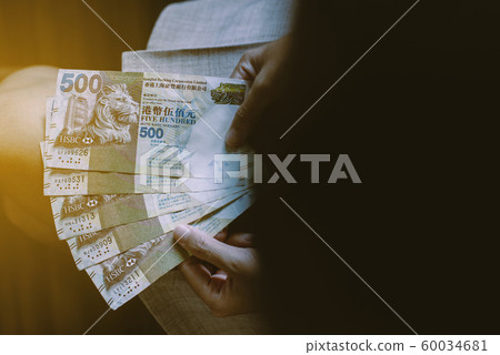 Hands bussiness woman counting five hundred Hong Kong banknotes,Close up Hands bussiness woman counting five hundred Hong Kong banknotes,Close up 60034681