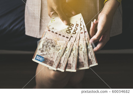 Hands woman counting five hundred hong kong banknotes,Close up Hands woman counting five hundred hong kong banknotes,Close up 60034682