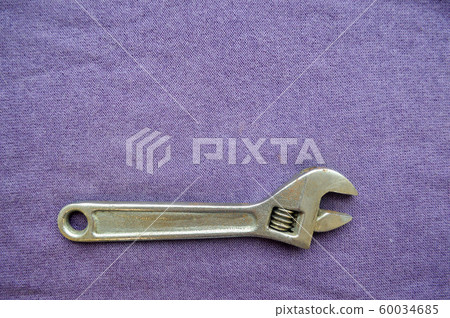 Metal, iron, shiny, adjustable wrench Metal, iron, shiny, adjustable wrench 60034685