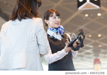 Airport ground staff guiding 60035298