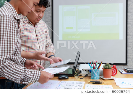Graphic designers work together with UX UI 60036764
