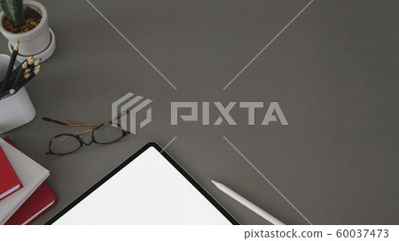 Top view of trendy workplace with tablet and 60037473