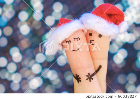 Fingers art of couple celebrates Christmas. 60038827