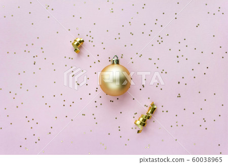 Christmas sparkles composition. Christmas ball and golden stars on pastel pink background. Christmas sparkles composition. Christmas ball and golden stars on pastel pink background. 60038965