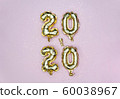 Vertical 2020 Happy New year celebration. Gold foil balloons numeral 2020 and golden stars on pastel 60038967