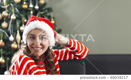 Christmas woman in Santa hat Christmas woman in Santa hat 60039217