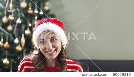 Christmas woman in Santa hat Christmas woman in Santa hat 60039219