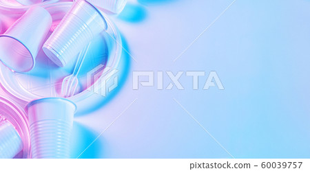 Disposable plastic tableware on a light background in pastel colors. Minimalistic ecologically clean still life. Pop Art. And ecology problem concept. 60039757