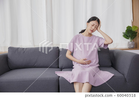 Happy young parents with baby 206 60040318