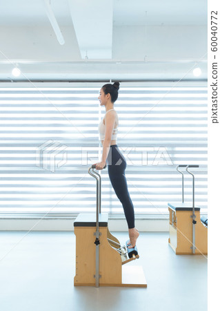 Healthy life, exercising pilates using pilates device 137 Healthy life, exercising pilates using pilates device 137 60040772