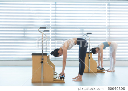 Healthy life, exercising pilates using pilates device 133 60040808