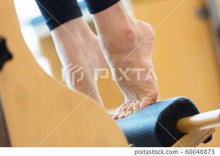 Healthy life, exercising pilates using pilates device 141 60040873