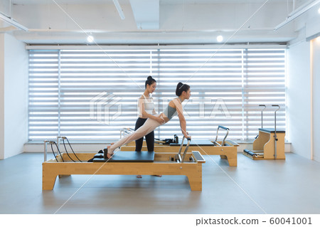 Healthy life, exercising pilates using pilates device 023 60041001