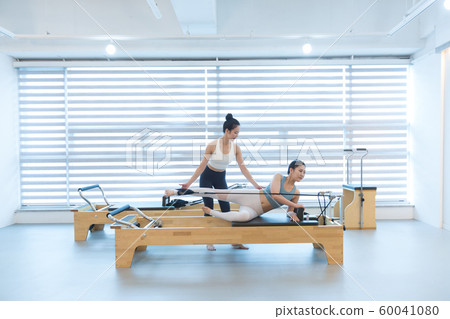 Healthy life, exercising pilates using pilates device 076 60041080
