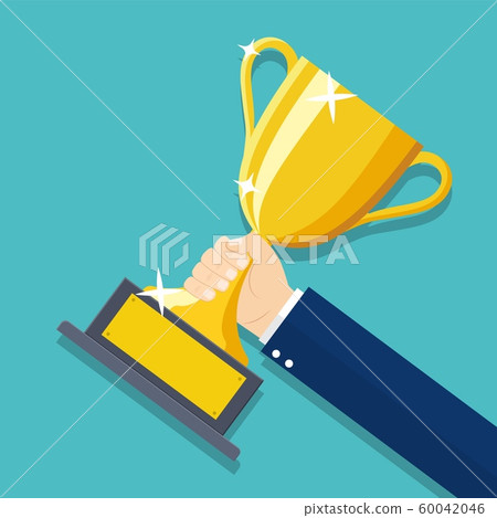 Businessman hand holding Gold Trophy Cup. 60042046