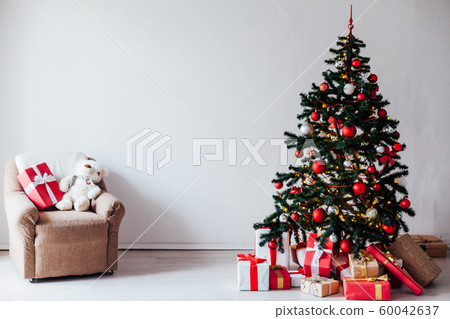 Christmas decor house Christmas tree with gifts for the new year as a background Christmas decor house Christmas tree with gifts for the new year as a background 60042637