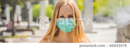 women wearing facial hygienic mask for Safety outdoor. People in masks because of fine dust 60043076