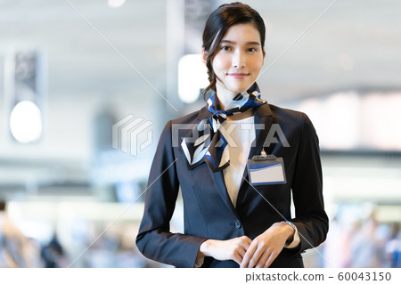 Female airport staff Female airport staff 60043150