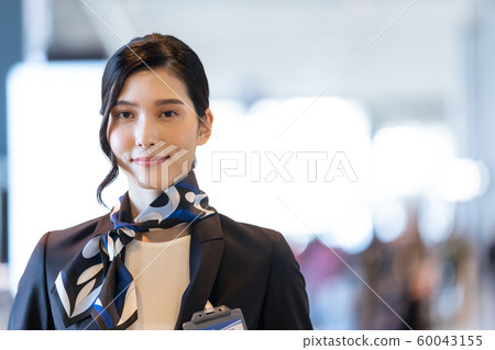 Female airport staff Female airport staff 60043155